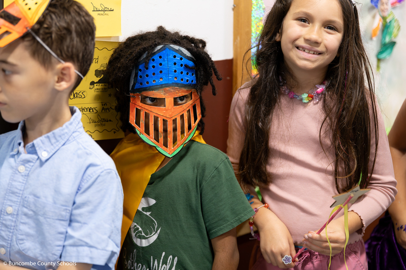 Kid dressed up as a knight. 
