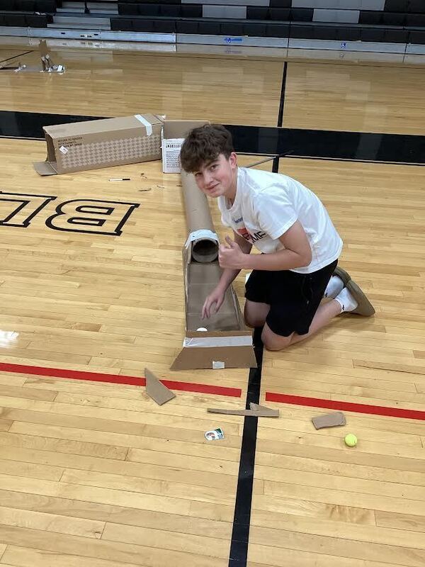 Student next to his putt-putt course.