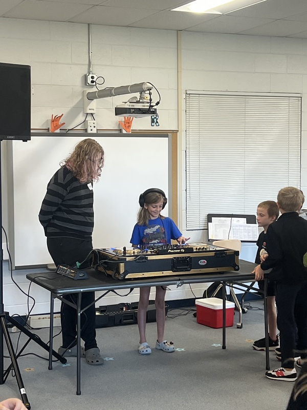 Students learning about how a turn table works.