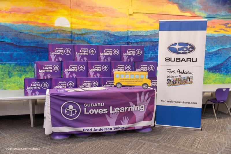 table set up with boxes of school supplies