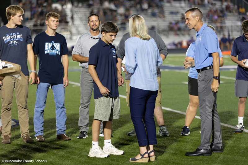 Student receiving his state championship ring.
