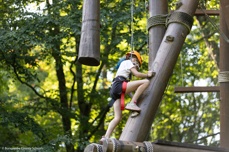 Girl on the ropes course. 