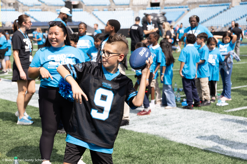 Kid throwing a football