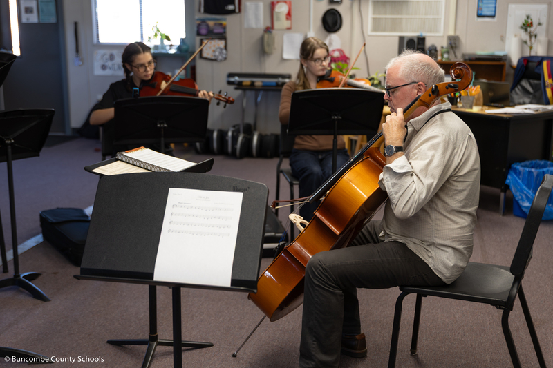 Mr. Kinne playing the cello.