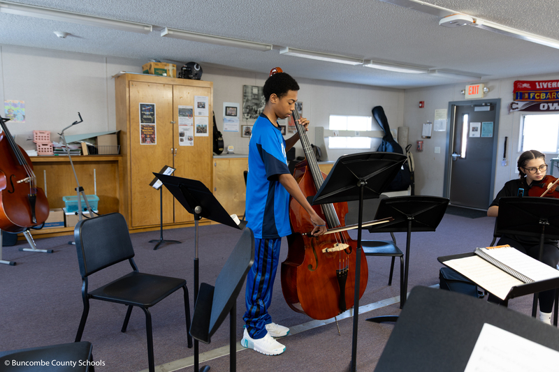 Boy playing the bass.