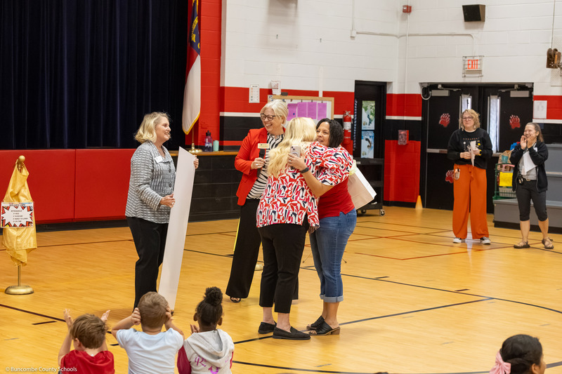 Angie Trantham giving board member Kim Plemmons a hug.