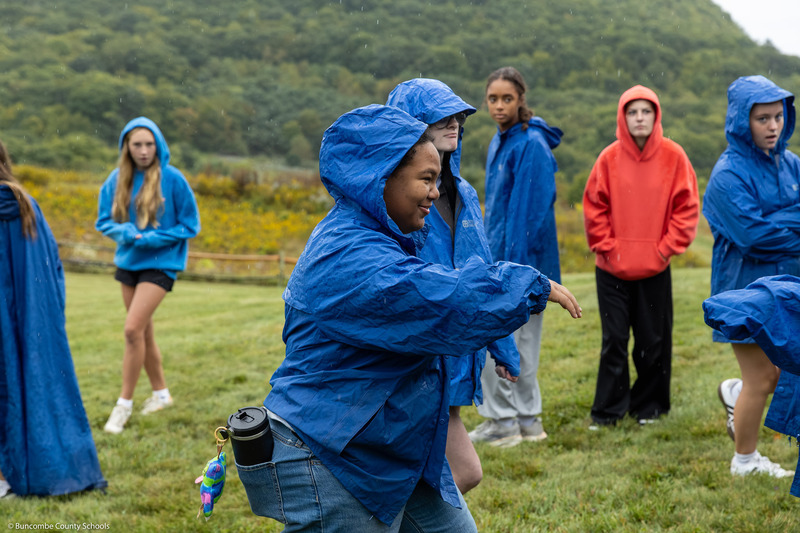 A student smiles during an outdoor game.