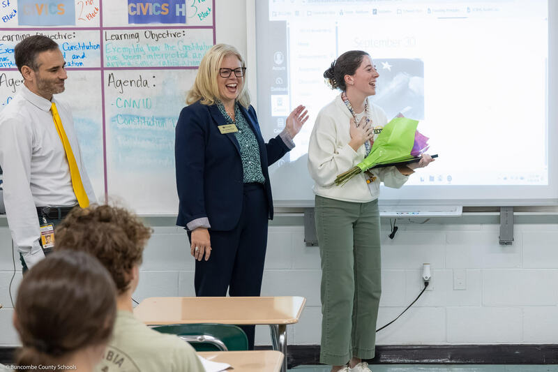 Principal Ben Alexander, Superintendent Jennifer Reed and Annali Silver laughing.