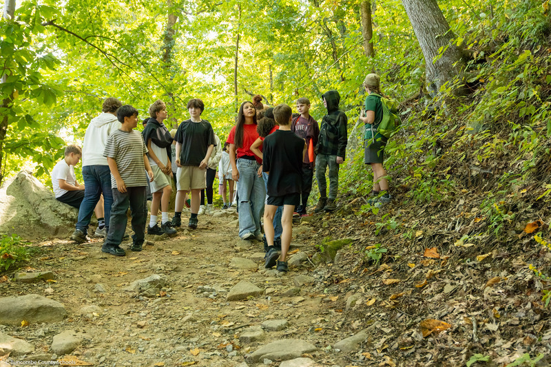Students gather in a section of the Hickory Nut Falls Trail.