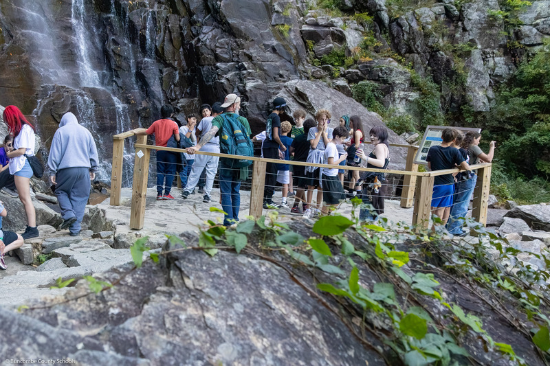 A group of A.C. Reynolds Middle School seventh graders stand on the Hickory Nut Falls viewing platform.