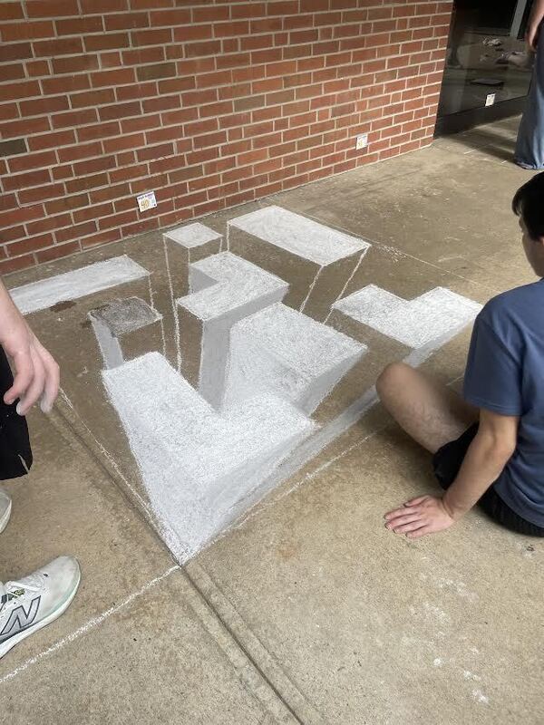 Students working on their artwork.