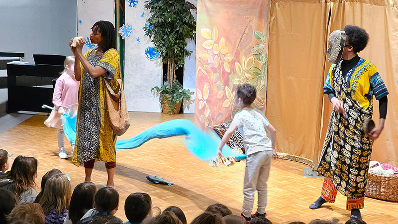 Kids on stage acting with the adult actors. 
