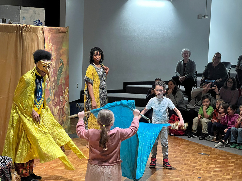 Kids on stage with the adult actors. 