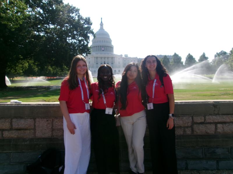 Senior Jordan Roberts with three friends in front of the Capitol Building. 