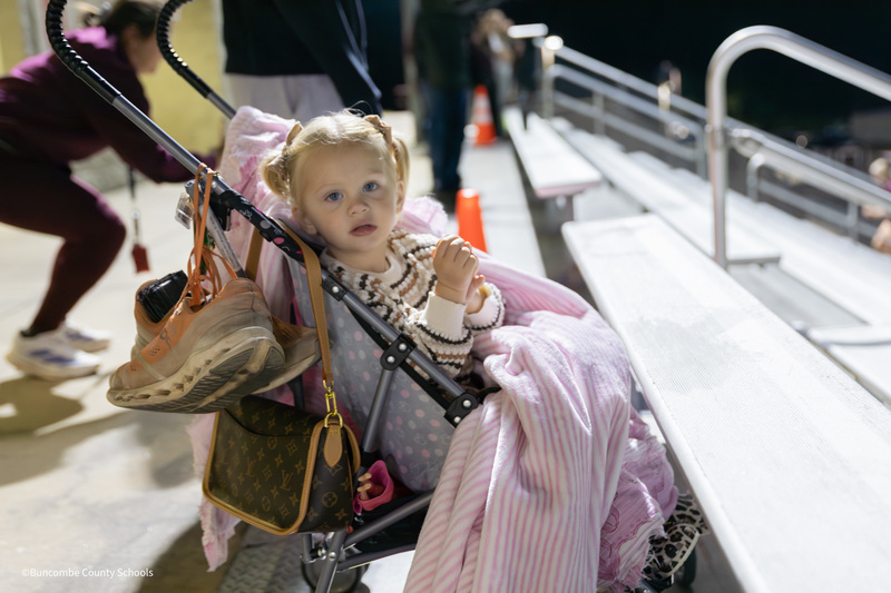 little girl in stroller