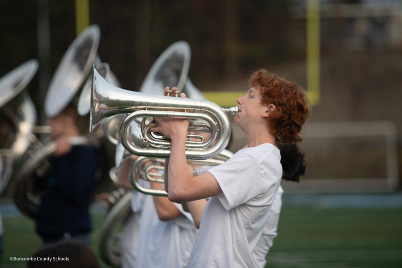 A member of the Enka Middle School band plays his baritone.