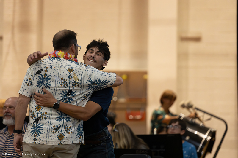 Mr. Honeycutt hugs his son