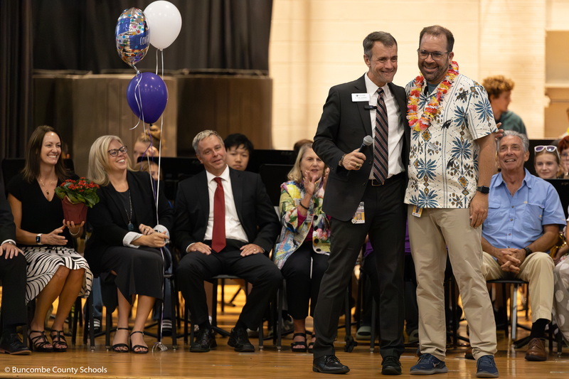 Dr. Jackson stands next to Mr. Honeycutt on stage 