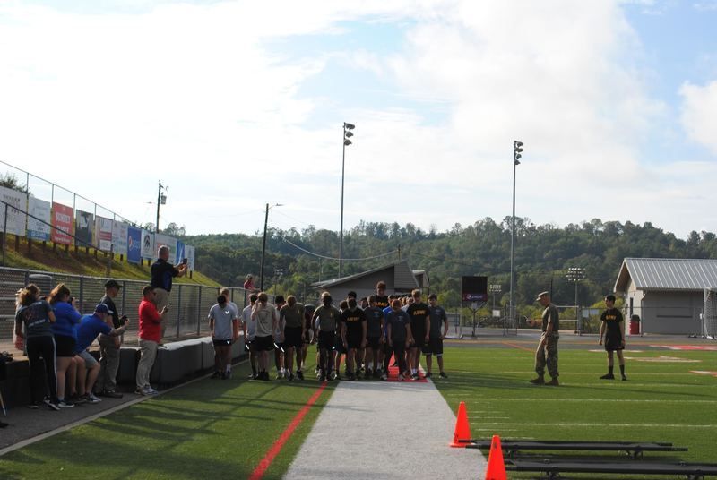 Teams getting to run around the football stadium. 