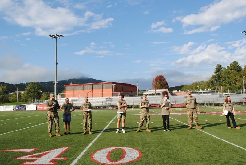 Erwin JROTC standing on the line at the Erwin High football field. 