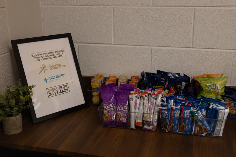 A basket of snacks on a shelf in the Estes serenity room