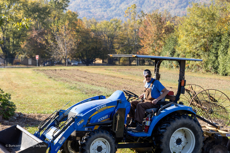 Mr. Foote sits on a tractor