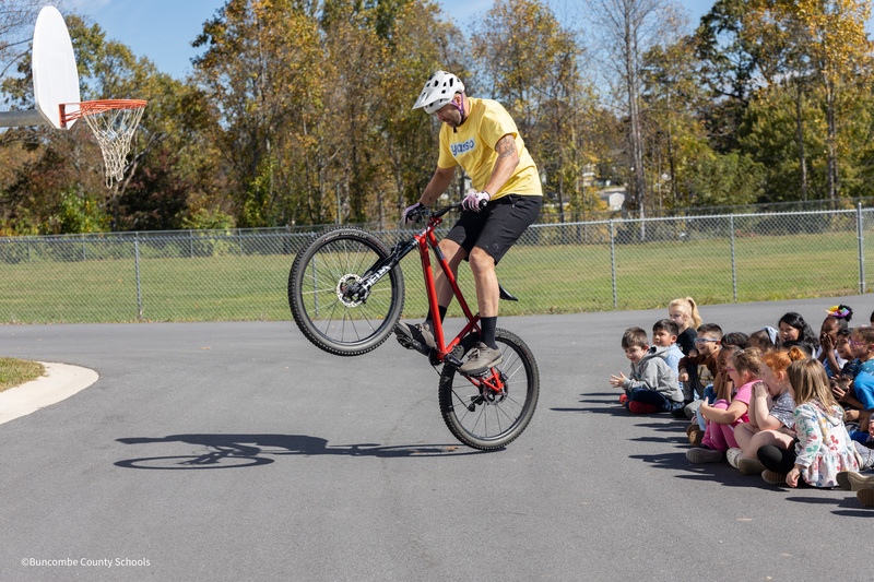Biker showing students tricks