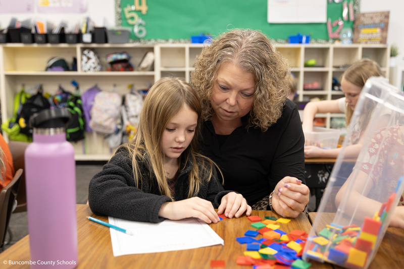 Kelly Owen helping third grader Aspen with a Math problem. 