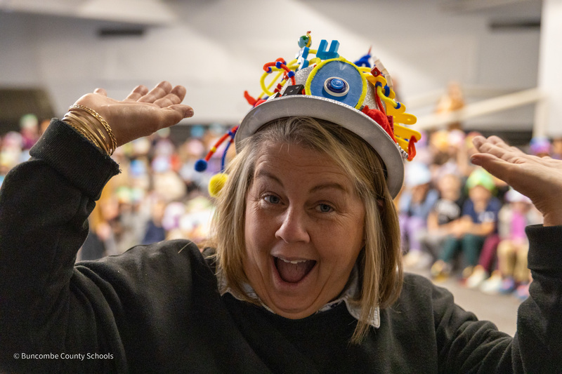 A teacher poses in her thinking cap
