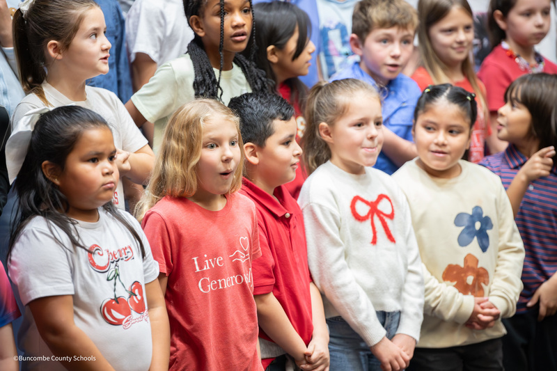 student excited to see family in the crowd