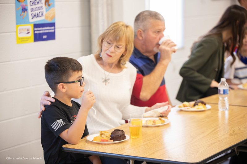 grandparents and students eating
