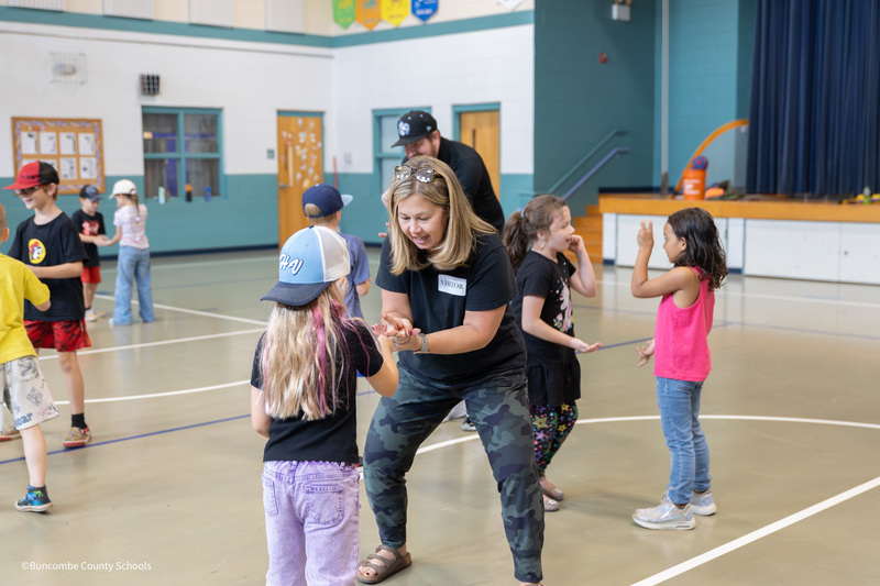 students playing games with parents
