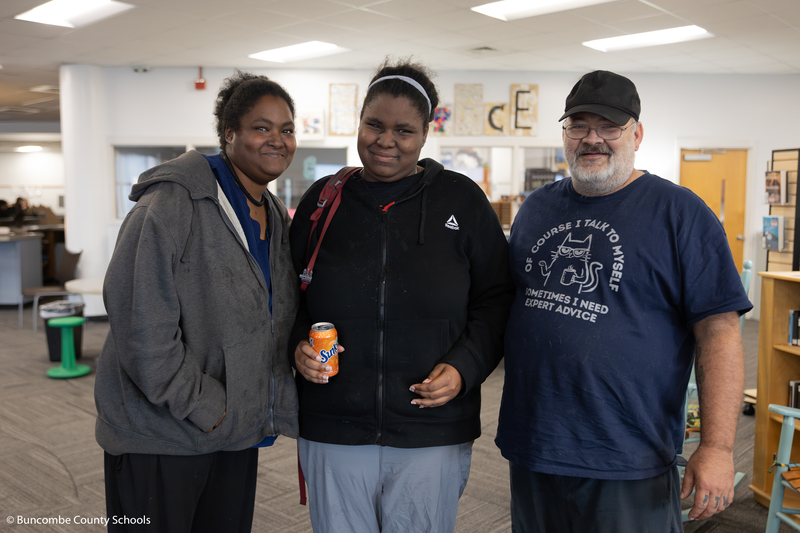 Student posing with family for a photo. 