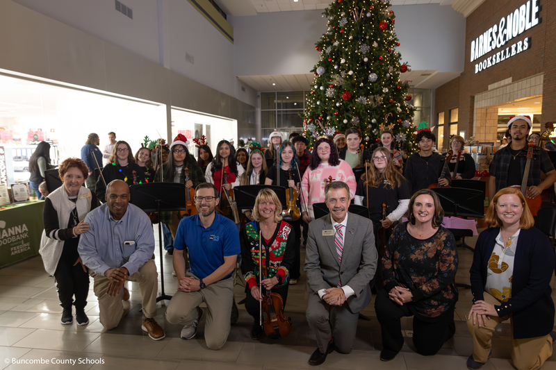 Group photo of the orchestra, along with special guests.