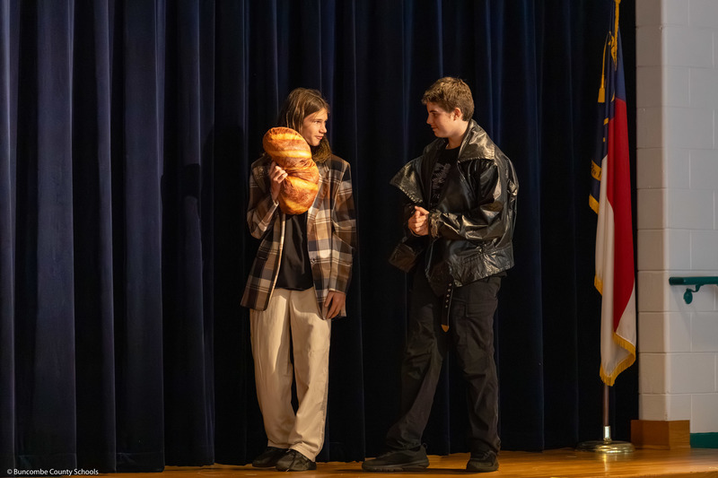 Two students perform a skit during the dress rehearsal.