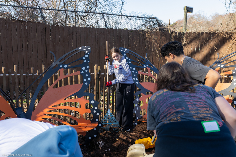 Students help clean up the grounds of WNC Nature Center.
