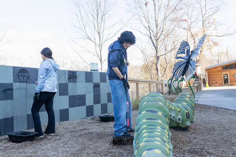 Students help clean up the grounds of WNC Nature Center.