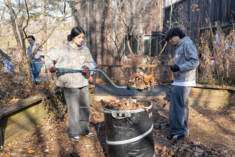 Students help clean up the grounds of WNC Nature Center.