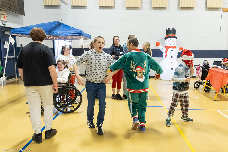 A student and teacher dance.