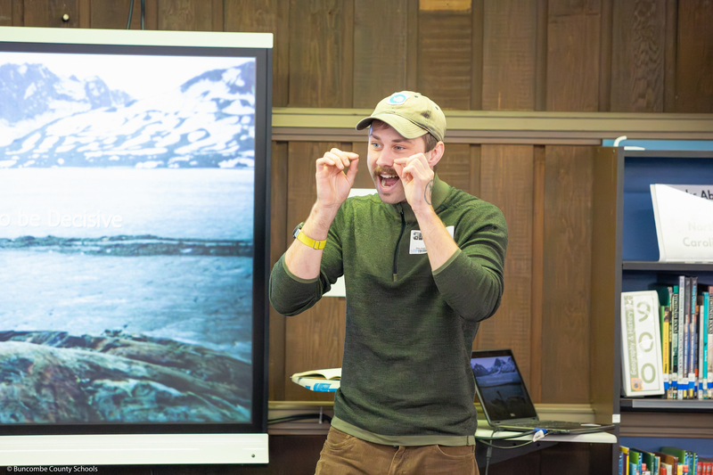 Jacob Myers speaks to students in the media center.
