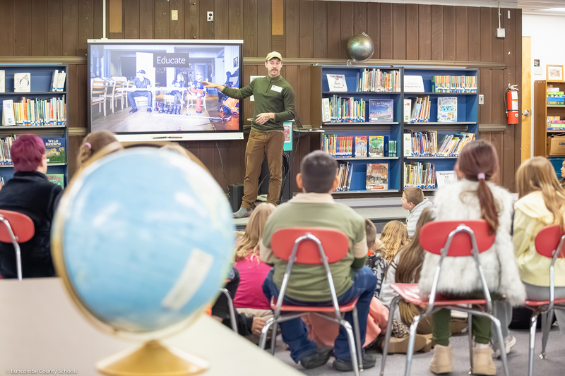 Jacob Myers speaks to students in the media center.