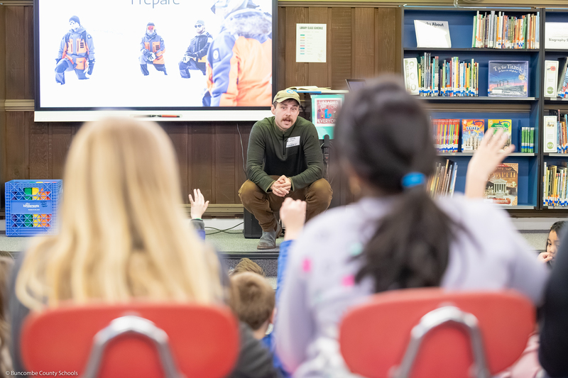 Jacob Myers speaks to students in the media center.