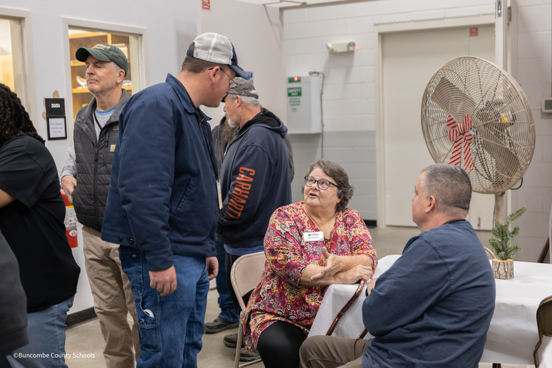 Ann Franklin talking with two maintenance workers