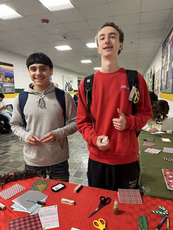 Two male students smiling at the camera. 