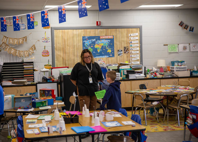 A teacher talks to a student.