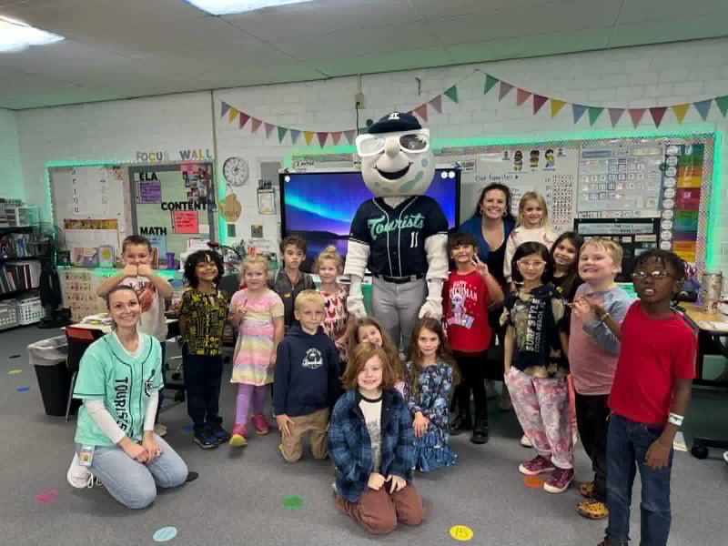 Group photo of a first grade class with Mr. Moon. 
