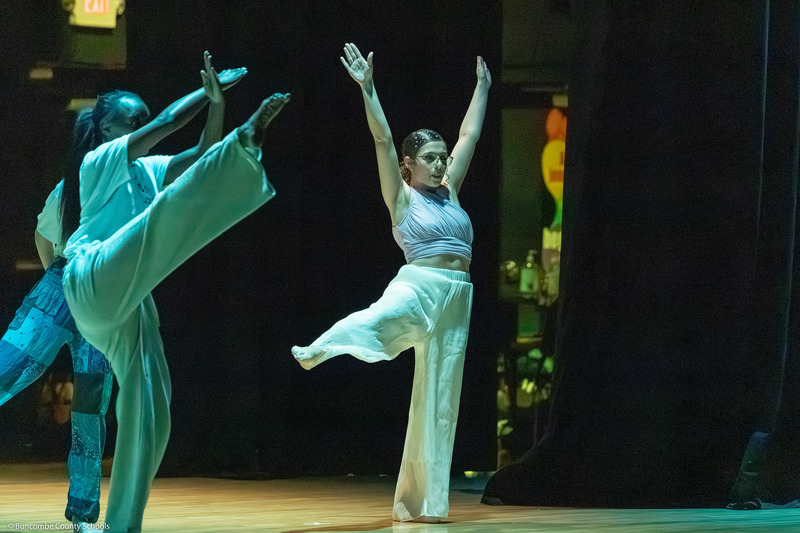 Erwin High dance students perform on stage.