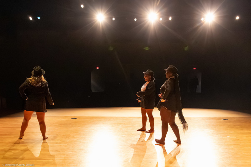 Erwin High dance students perform on stage.