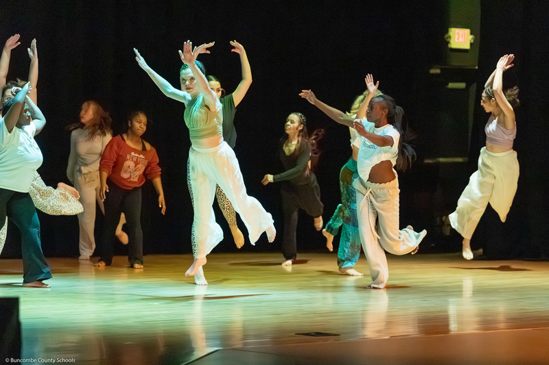 Erwin High dance students perform on stage.