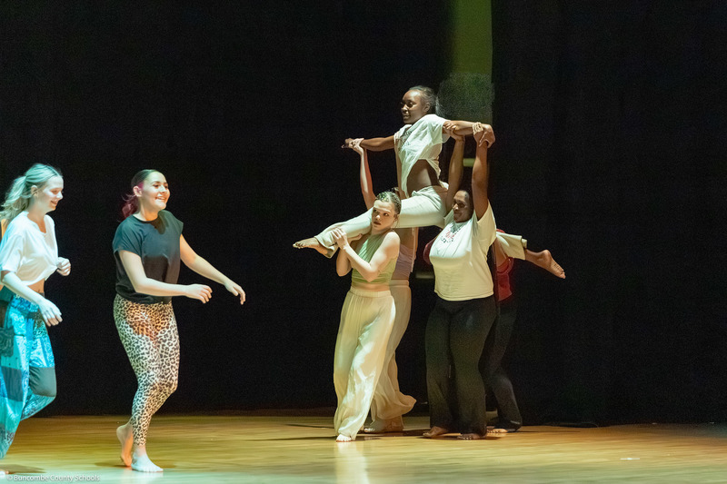 Erwin High dance students perform on stage.